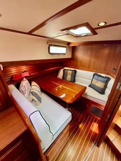 Serendipity II Yacht Photos Pics Luxurious interior of 2010 Sabre 40 Sedan yacht with wood finish and cozy seating.