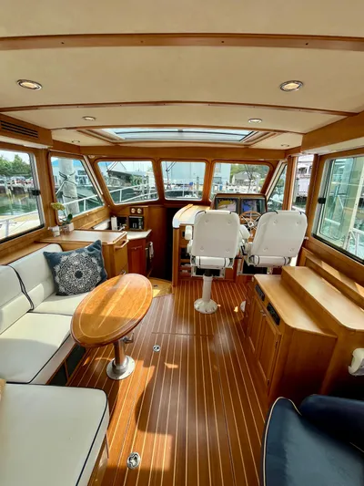 Serendipity II Yacht Photos Pics Luxurious interior of 2010 Sabre 40 Sedan yacht with wood flooring and plush seating.