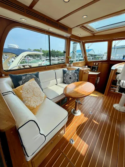 Serendipity II Yacht Photos Pics Luxurious interior of 2010 Sabre 40 Sedan yacht with elegant seating and wooden finishes.