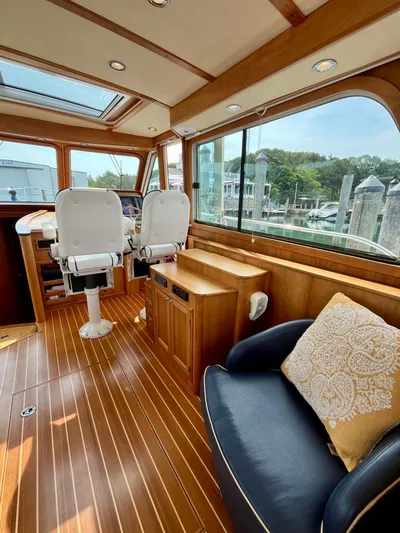 Serendipity II Yacht Photos Pics Interior of 2010 Sabre 40 Sedan yacht with wooden flooring and plush seating.