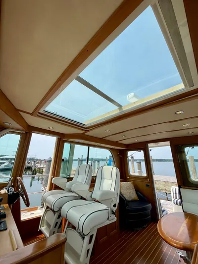 Serendipity II Yacht Photos Pics Interior of 2010 Sabre 40 Sedan yacht with skylight and luxurious seating.