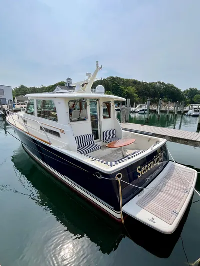 Serendipity II Yacht Photos Pics 2010 Sabre 40 Sedan yacht docked, featuring elegant design and spacious deck seating.