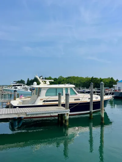 Serendipity II Yacht Photos Pics 2010 Sabre 40 Sedan docked at a marina under clear blue skies.