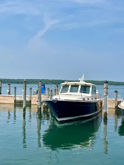 Serendipity II Yacht Photos Pics 2010 Sabre 40 Sedan docked at a marina on a sunny day.