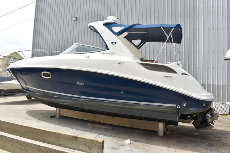 Windy Gale IV Yacht Photos Pics 2011 Sea Ray 310 Sundancer boat with blue hull and white top, docked outdoors.