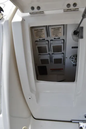 Windy Gale IV Yacht Photos Pics Electrical panel on a 2011 Sea Ray 310 Sundancer boat, featuring shore power connections.