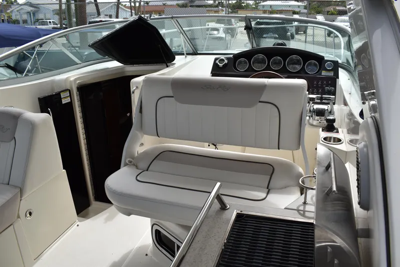 Windy Gale IV Yacht Photos Pics 2011 Sea Ray 310 Sundancer cockpit with helm, seating, and control panel.