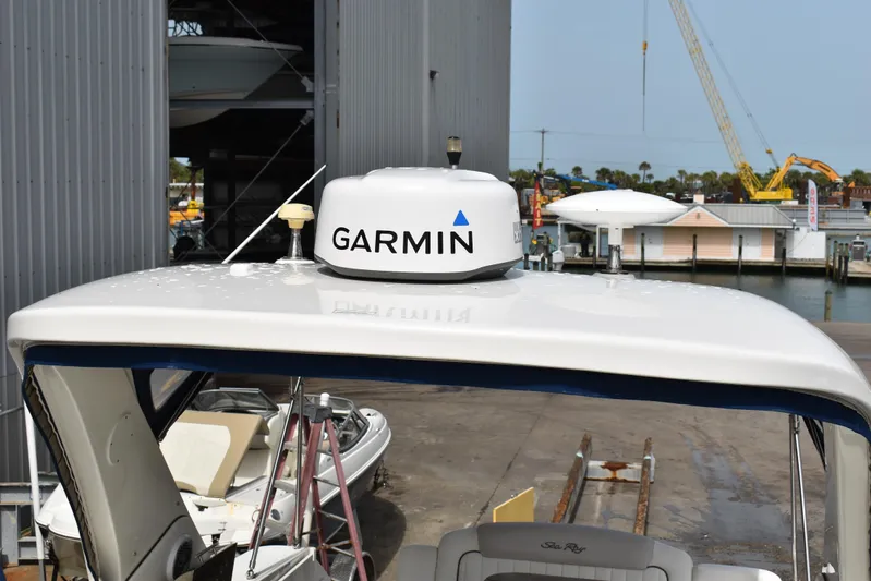 Windy Gale IV Yacht Photos Pics 2011 Sea Ray 310 Sundancer with Garmin radar, docked near a marina.