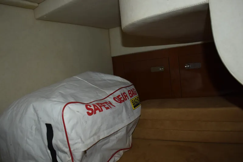 Windy Gale IV Yacht Photos Pics Interior of 2011 Sea Ray 310 Sundancer with safety gear bag and storage cabinets.