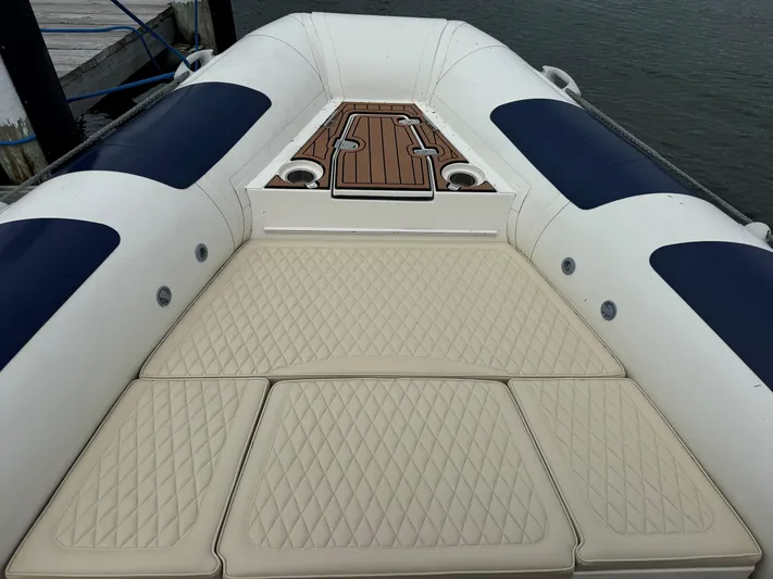  Yacht Photos Pics 2023 Ocean Craft Marine 9M Amphibious boat with cushioned deck and sleek design.