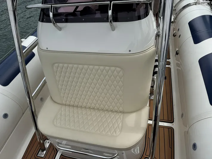  Yacht Photos Pics 2023 Ocean Craft Marine 9M Amphibious boat with cushioned seating and sleek design.