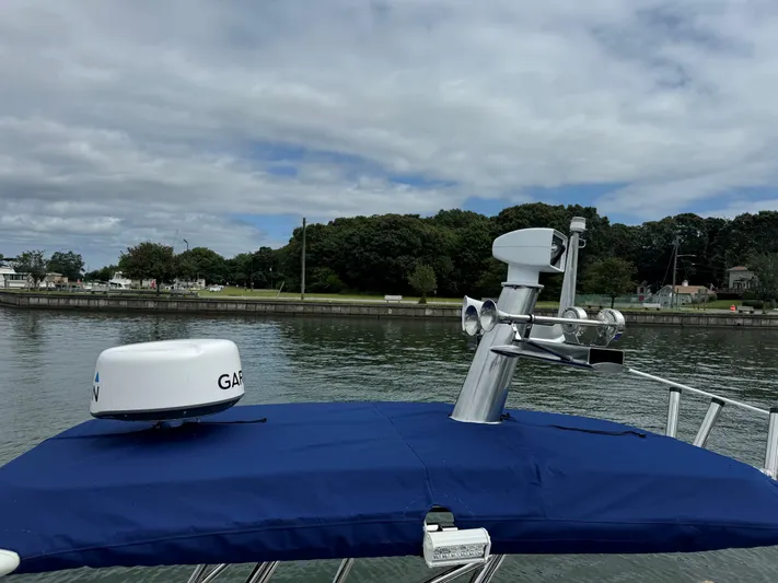  Yacht Photos Pics 2023 Ocean Craft Marine 9M Amphibious boat with radar equipment on calm water.