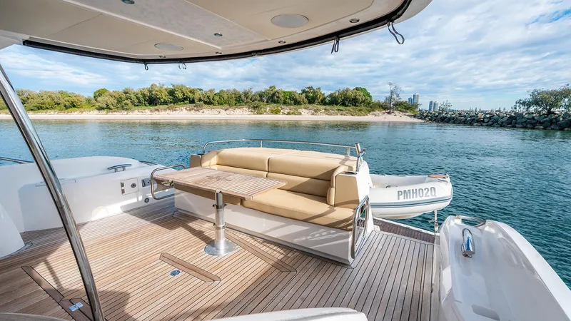 Cloud Catcher Yacht Photos Pics Luxurious 2014 Sunseeker Manhattan 55 yacht with elegant deck seating and scenic water view.