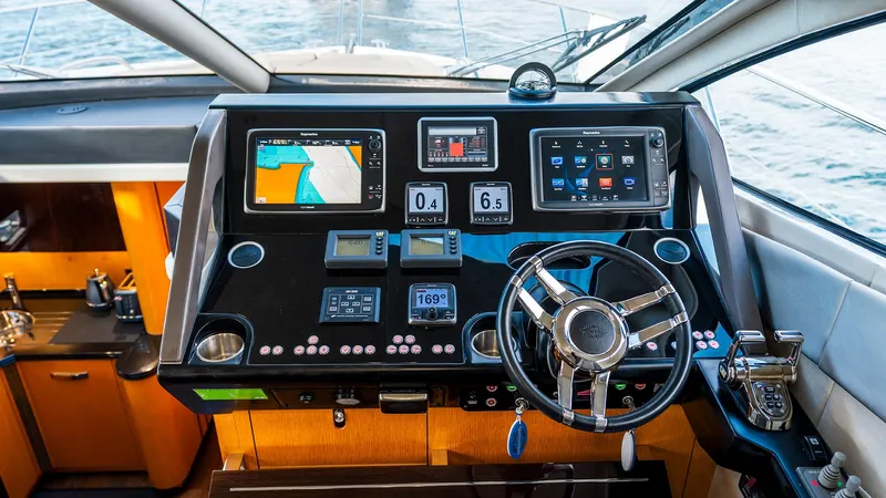 Cloud Catcher Yacht Photos Pics Helm of 2014 Sunseeker Manhattan 55 yacht with advanced navigation systems and controls.