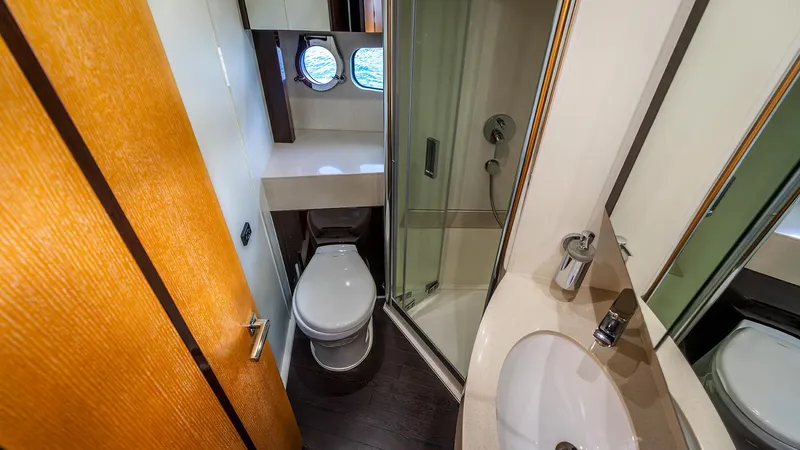 Cloud Catcher Yacht Photos Pics Luxurious bathroom in 2014 Sunseeker Manhattan 55 yacht, featuring modern fixtures and elegant design.