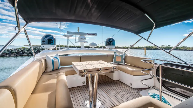 Cloud Catcher Yacht Photos Pics Luxurious 2014 Sunseeker Manhattan 55 yacht interior with elegant seating and scenic water view.