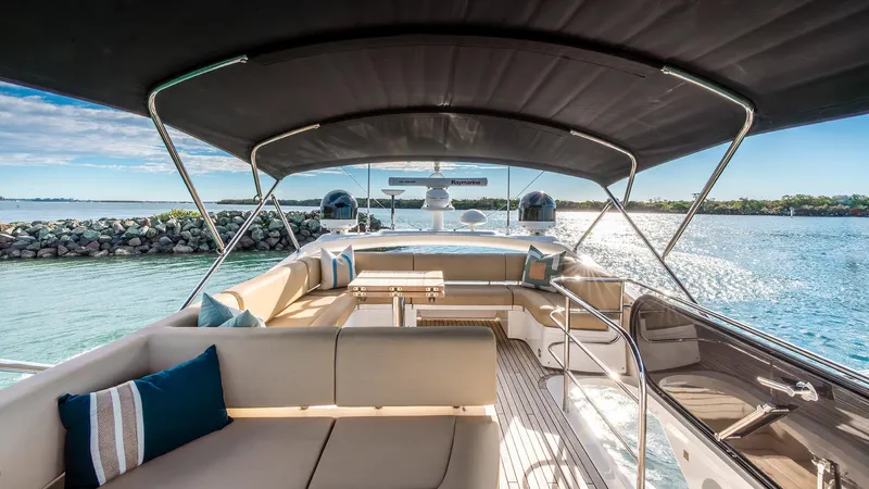 Cloud Catcher Yacht Photos Pics Luxurious 2014 Sunseeker Manhattan 55 yacht interior with elegant seating and scenic ocean view.