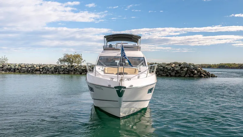 Cloud Catcher Yacht Photos Pics 2014 Sunseeker Manhattan 55 yacht on calm water, clear sky background.