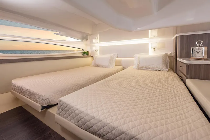  Yacht Photos Pics Manufacturer Provided Image: Luxurious cabin interior of 2025 Regal 38 FXO yacht with twin beds and modern design.