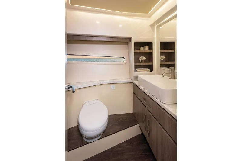  Yacht Photos Pics Manufacturer Provided Image: Luxurious bathroom in 2025 Regal 38 FXO yacht with modern fixtures and elegant design.