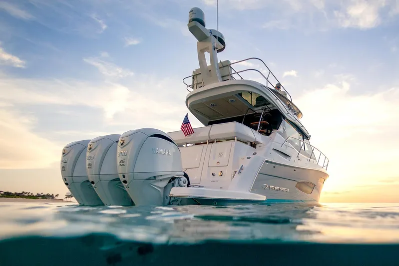  Yacht Photos Pics Manufacturer Provided Image: 2025 Regal 38 FXO yacht with triple engines at sunset on the water.