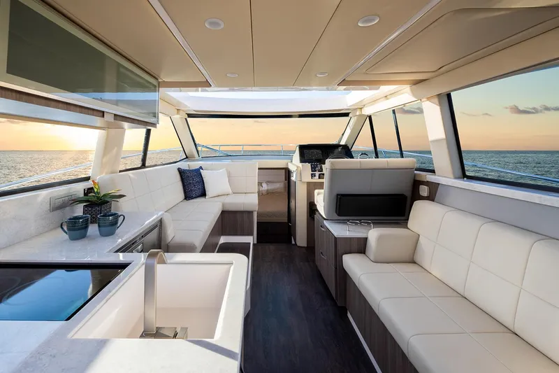  Yacht Photos Pics Manufacturer Provided Image: Luxurious interior of 2025 Regal 38 FXO yacht with ocean view at sunset.