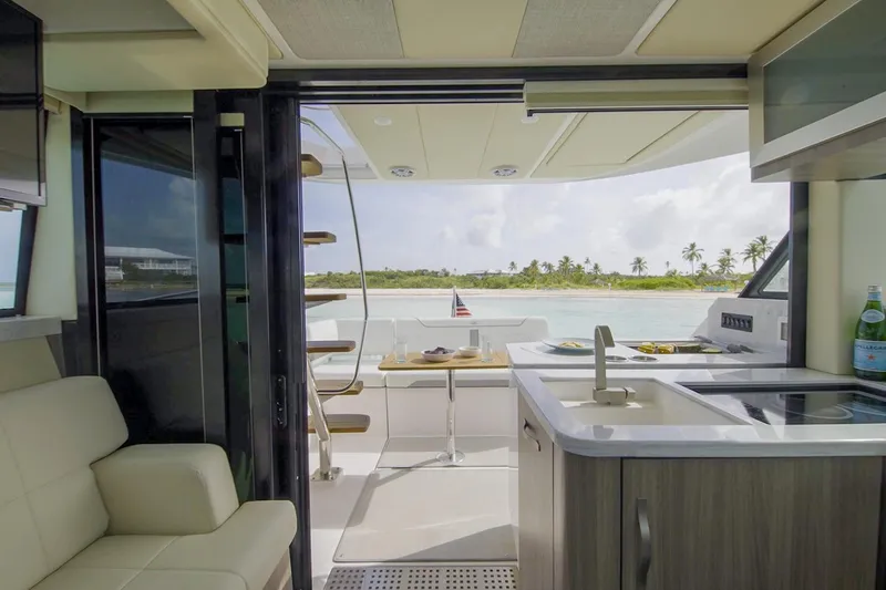  Yacht Photos Pics Manufacturer Provided Image: Interior view of 2025 Regal 38 FXO yacht with ocean backdrop.