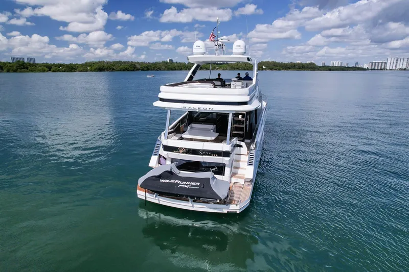 Gold Star Yacht Photos Pics 2020 Galeon 640 Fly yacht on calm water under a partly cloudy sky.