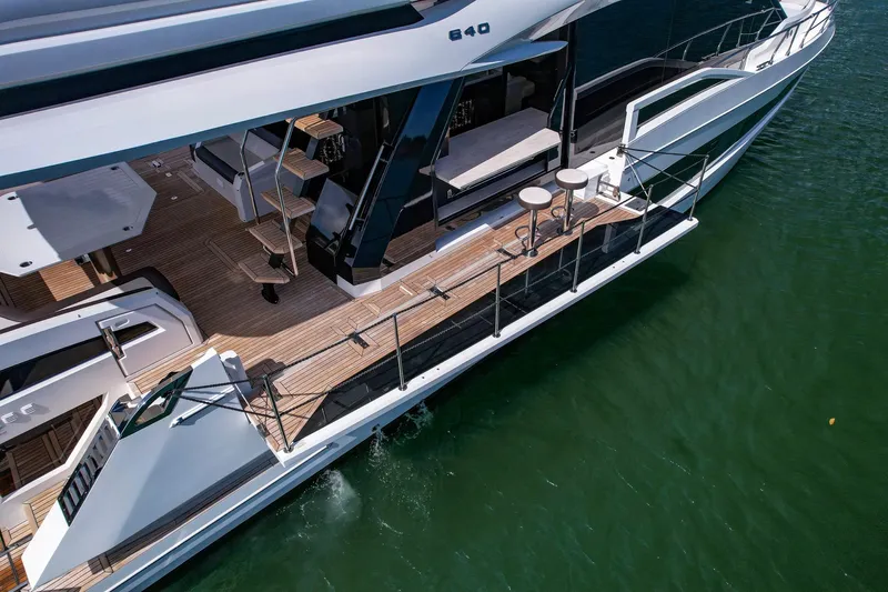 Gold Star Yacht Photos Pics Luxurious 2020 Galeon 640 Fly yacht with spacious deck and modern design on calm water.