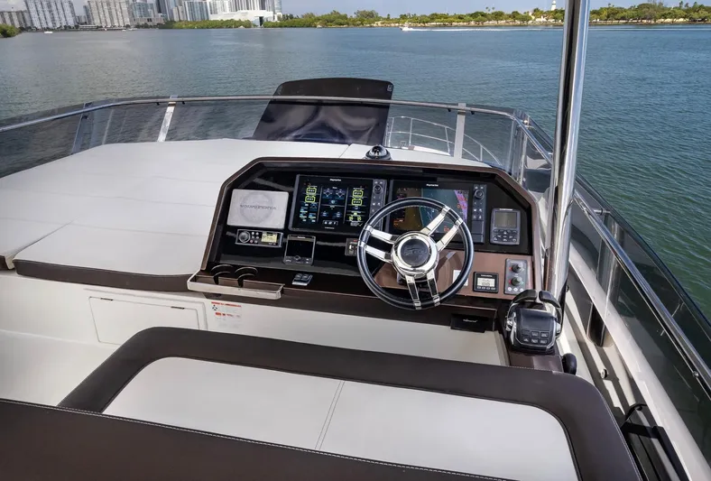 Gold Star Yacht Photos Pics 2020 Galeon 640 Fly yacht helm with modern navigation controls on open water.