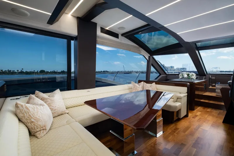 Gold Star Yacht Photos Pics Luxurious interior of 2020 Galeon 640 Fly yacht with elegant seating and panoramic windows.
