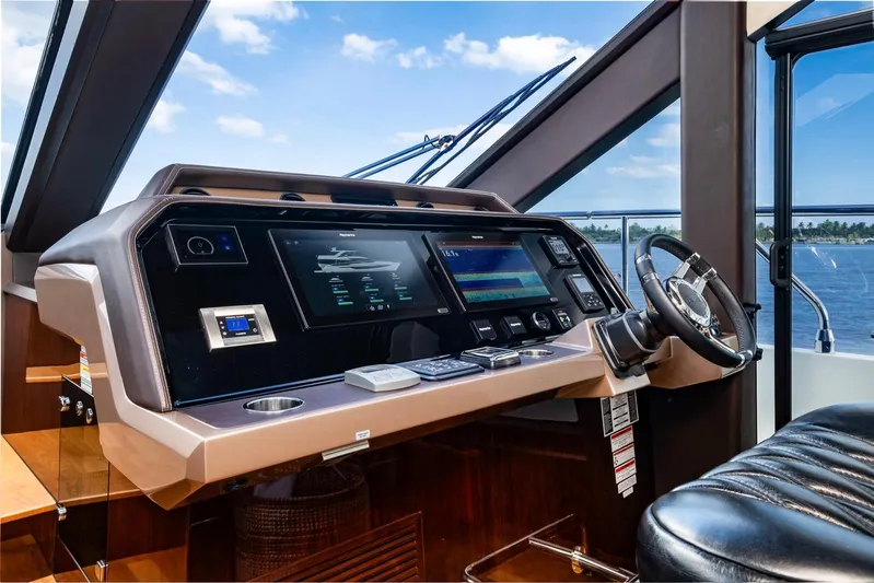 Gold Star Yacht Photos Pics Helm of 2020 Galeon 640 Fly yacht with modern navigation controls.