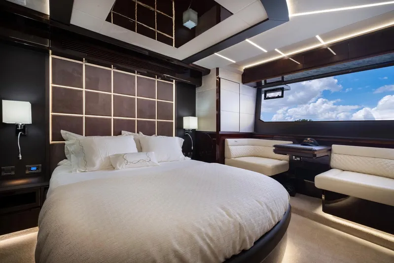 Gold Star Yacht Photos Pics Luxurious bedroom interior of 2020 Galeon 640 Fly yacht with modern design and large window view.