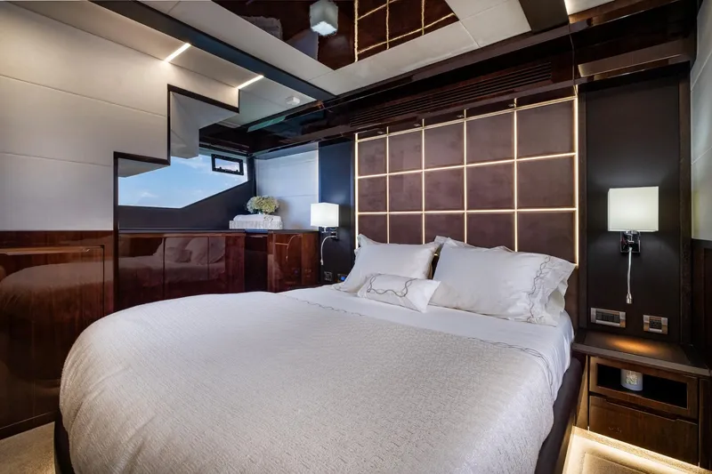 Gold Star Yacht Photos Pics Luxurious bedroom interior on 2020 Galeon 640 Fly yacht, featuring elegant design and modern lighting.