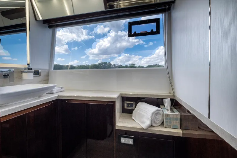 Gold Star Yacht Photos Pics Luxurious bathroom interior of 2020 Galeon 640 Fly yacht with scenic window view.