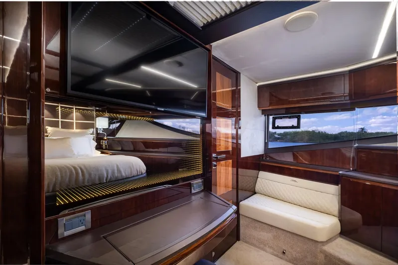 Gold Star Yacht Photos Pics Luxurious interior of 2020 Galeon 640 Fly yacht with modern furnishings and large windows.