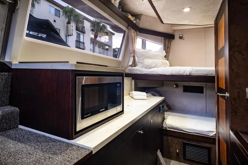 Gold Star Yacht Photos Pics Luxurious interior of 2020 Galeon 640 Fly yacht with modern amenities and cozy sleeping area.