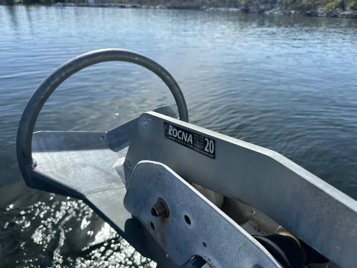  Yacht Photos Pics Rocna 20 anchor on 1982 Tollycraft Tri Cabin, floating on calm water.