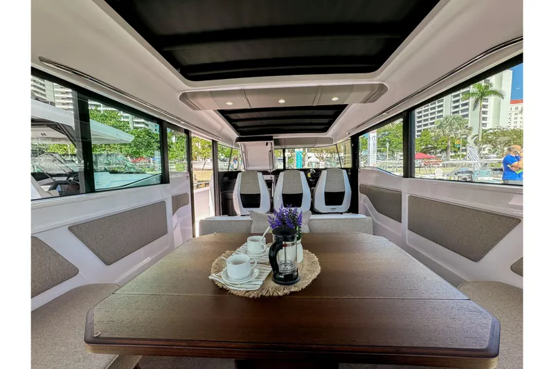  Yacht Photos Pics 2024 Axopar 45 XC Cross Cabin interior with elegant seating and dining area.