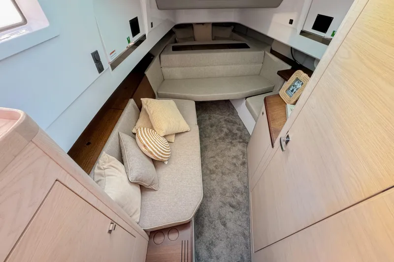  Yacht Photos Pics 2024 Axopar 45 XC Cross Cabin interior with cozy seating and modern design.