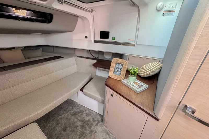  Yacht Photos Pics 2024 Axopar 45 XC Cross Cabin interior with cozy seating and elegant decor.