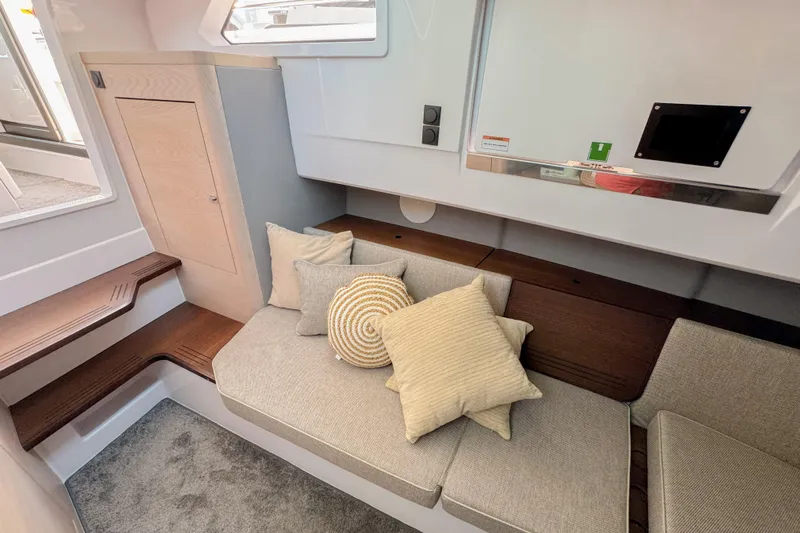  Yacht Photos Pics 2024 Axopar 45 XC Cross Cabin interior with cozy seating and modern design.