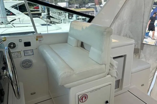  Yacht Photos Pics Interior of 2000 Tiara Yachts 4100 Open, featuring a white captain's seat and control panel.