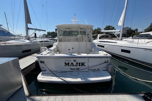  Yacht Photos Pics 2000 Tiara Yachts 4100 Open docked, rear view, with "MAJIK" name visible.