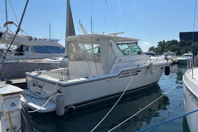  Yacht Photos Pics 2000 Tiara Yachts 4100 Open docked in a marina under clear skies.