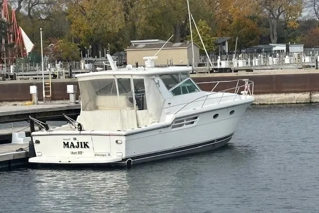  Yacht Photos Pics 2000 Tiara Yachts 4100 Open docked in a marina, rear view.
