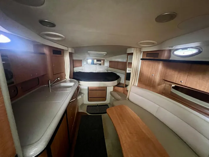  Yacht Photos Pics Interior of 2006 Sea Ray 340 Sundancer yacht with kitchen and seating area.