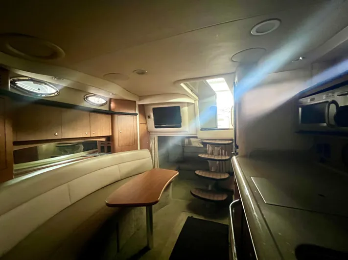  Yacht Photos Pics Interior of 2006 Sea Ray 340 Sundancer yacht, featuring cozy seating and modern amenities.