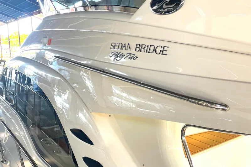  Yacht Photos Pics 2009 Sea Ray Sedan Bridge yacht, sleek white exterior with elegant design details.