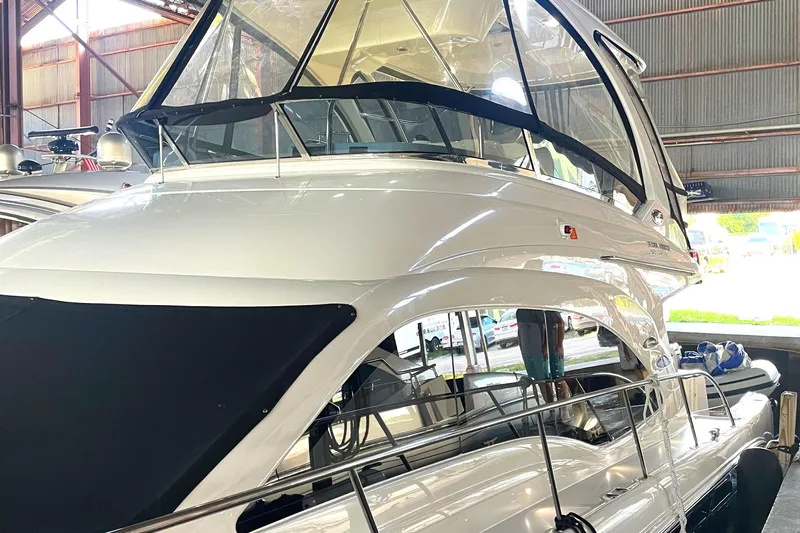  Yacht Photos Pics 2009 Sea Ray Sedan Bridge yacht in a marina, showcasing sleek design and modern features.